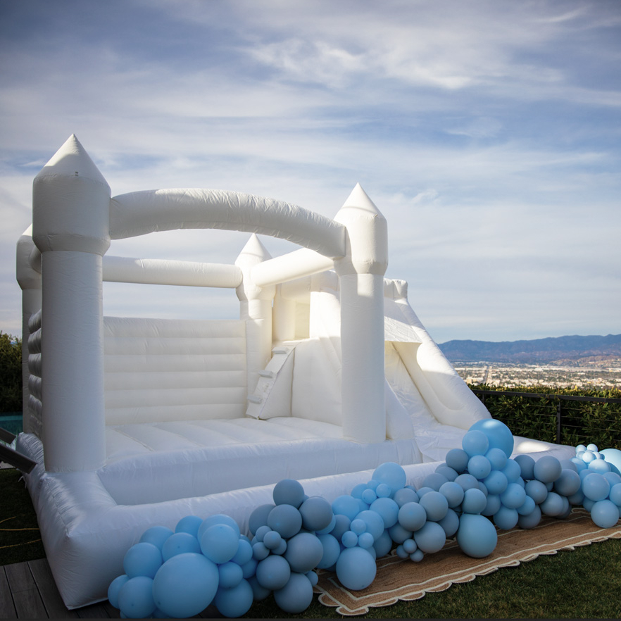 White castle with a slide and a dry pool